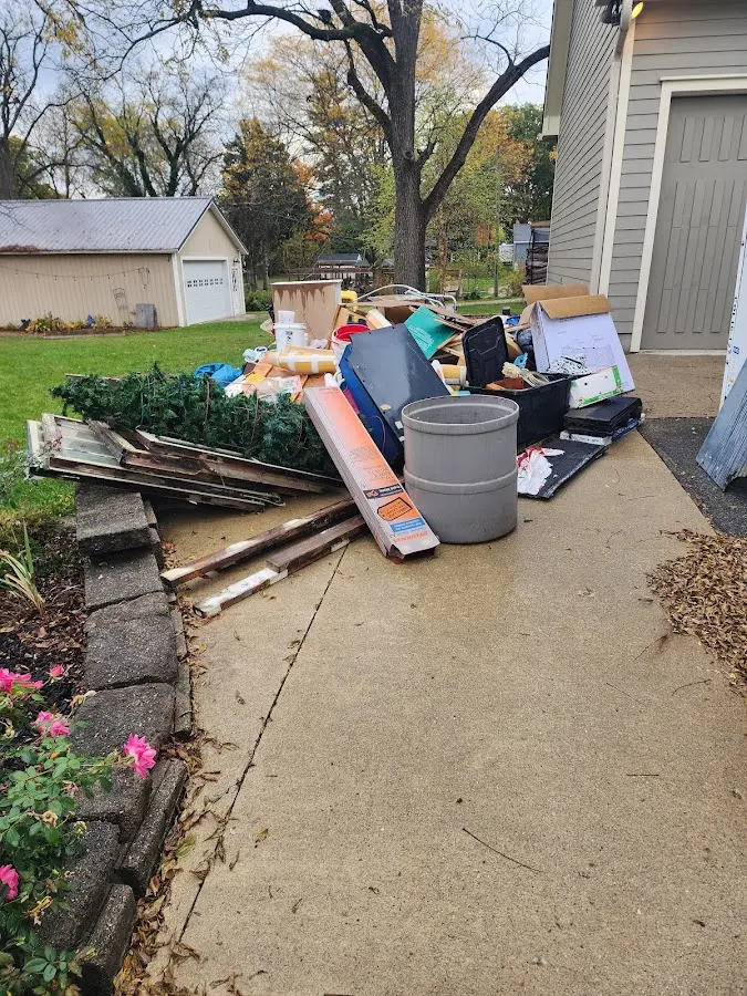 Dumpster being loaded with debris for 30 Yard Dumpster Rental in Lorton